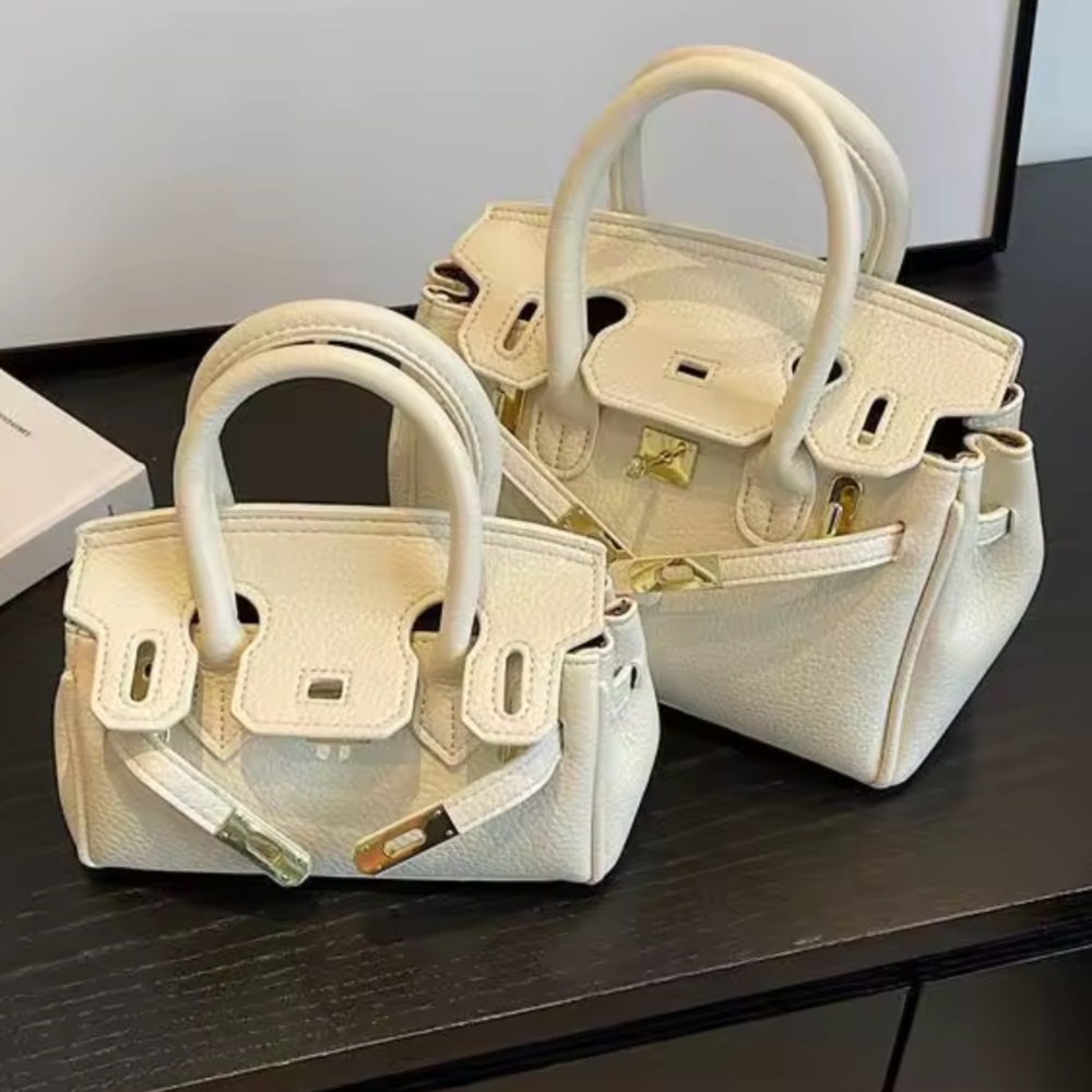 Elegant Stylish Cream High End Handbag ( Medium Size) with Pegasus Pendant Lock…